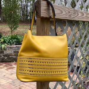 10 1/2” x 10 1/2” Golden yellow purse vegan leather. Never used